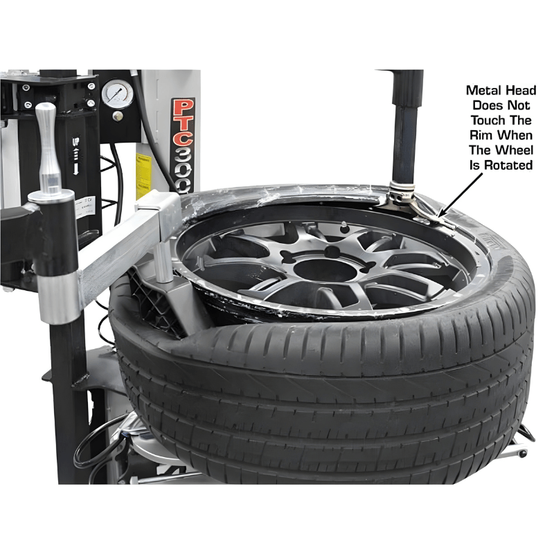 PTC300 Rim-Clamp Tire Changer w/ Assist Arm Removing Tire View