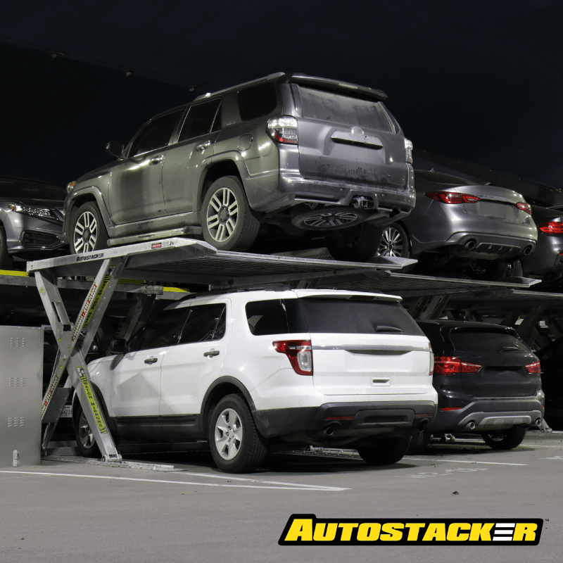 BendPak Autostacker A6S On Garage View with Cars Listing on It