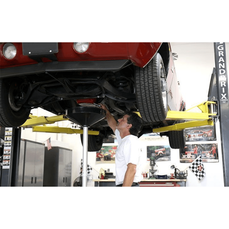 BendPak GP-7 with Car Lifting and a Man Working Below