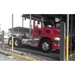 BendPak HDS-27X 27,000lb 4 Post Lift - Extended Length Red Truck Side View