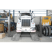 HDS-27X 27,000lb 4 Post Lift - Extended Length by BendPak Lifting a Truck Front View