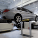 Challenger EV1020 Series 10K Standard Inground Lift With Car Lifting View