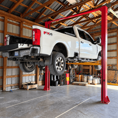 F250 on Katool 12000lb 2 post lift customer install with HeavyLift Direct