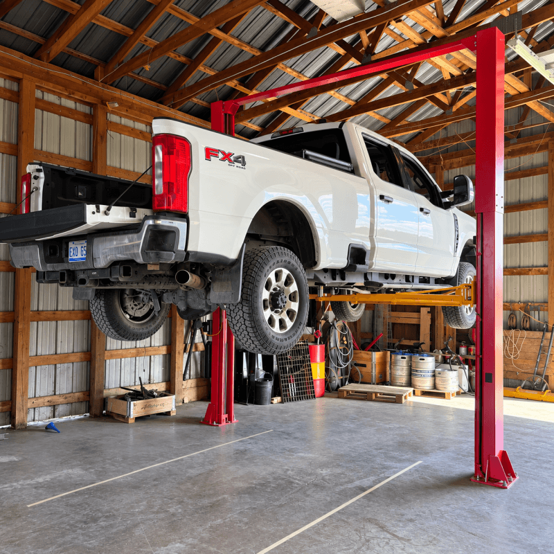 F250 on Katool 12000lb 2 post lift customer install with HeavyLift Direct