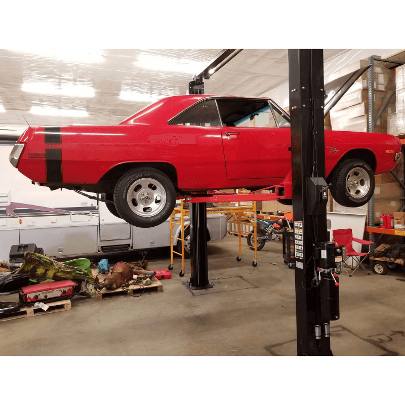 2PCF-9 9,000 lb. 2-Post Clear Floor Lift Side View with Red Car