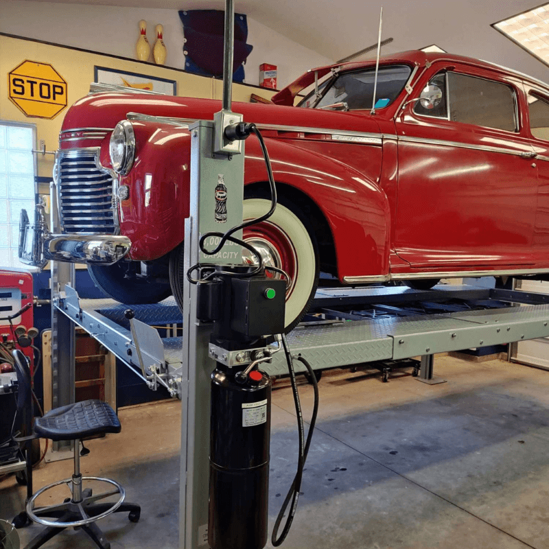 NSS8X-1 Vehicle Storage Lift Front View of the car and Panel View of the Lift
