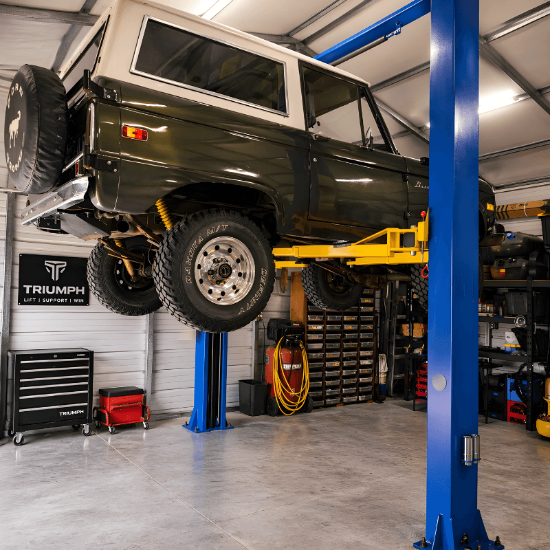 TP9KACX 9,000lb 2 Post Car Lift Clear Floor - Asymmetric Side View with Car Lifting